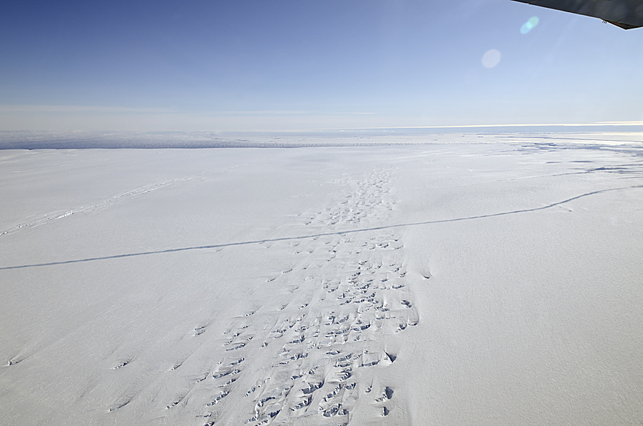 A crack runs across the floating ice shelf of Pine Island Glacier in Antarctica, seen from NASA's DC-8 on Oct. 14, 2011